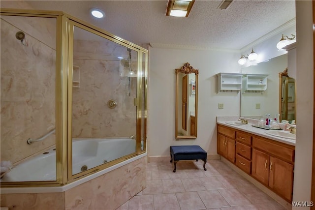 3541 Oak Bend Rd, Tuscaloosa, AL 35406 - bathroom with tile patterned floors, a textured ceiling, double vanity, and a combined bath / shower with jetted tub