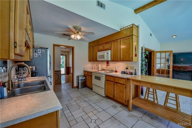 3541 Oak Bend Rd, Tuscaloosa, AL 35406 - kitchen featuring white appliances, light countertops, brown cabinetry, and ceiling fan
