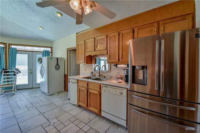 3541 Oak Bend Rd, Tuscaloosa, AL 35406 - kitchen featuring white appliances, light countertops, plenty of natural light, a textured ceiling, and ceiling fan