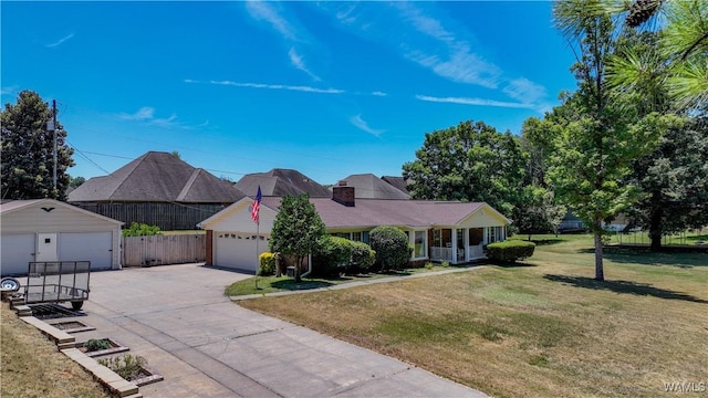 3541 Oak Bend Rd, Tuscaloosa, AL 35406 - view of front of home featuring driveway, an outbuilding, and a chimney
