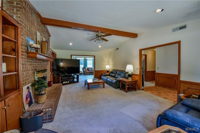 3541 Oak Bend Rd, Tuscaloosa, AL 35406 - carpeted living area with a wainscoted wall, a textured ceiling, a fireplace, ceiling fan, and recessed lighting