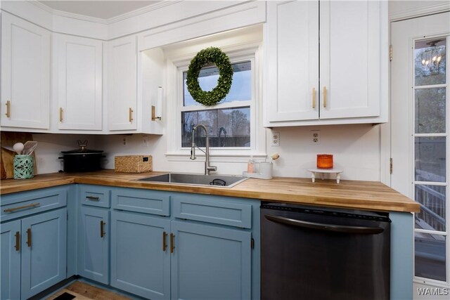 kitchen featuring a sink, blue cabinetry, dishwasher, and butcher block counters