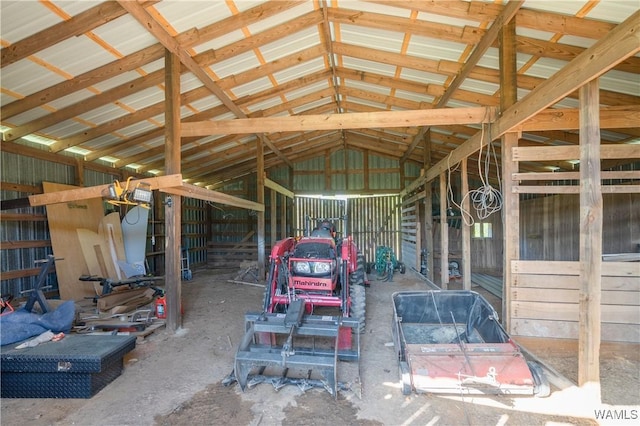 miscellaneous room with metal wall and lofted ceiling