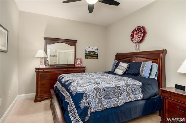 bedroom featuring light carpet and ceiling fan