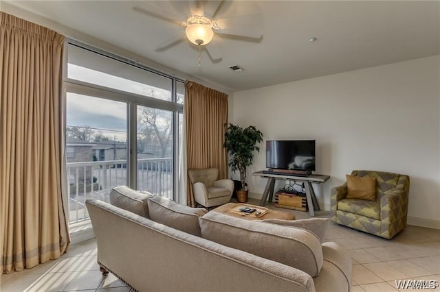 living room with light tile patterned flooring and ceiling fan