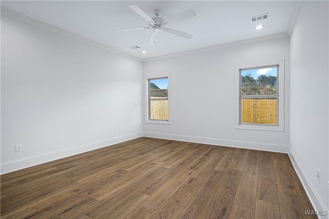 unfurnished room featuring hardwood / wood-style floors, ornamental molding, and ceiling fan