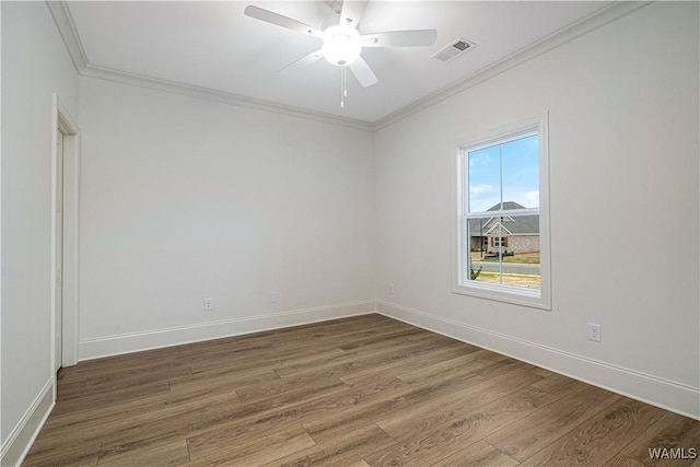 unfurnished room featuring crown molding, ceiling fan, and dark hardwood / wood-style flooring