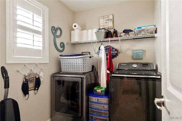 laundry area featuring laundry area and washer and clothes dryer