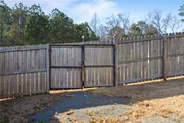 view of gate with fence