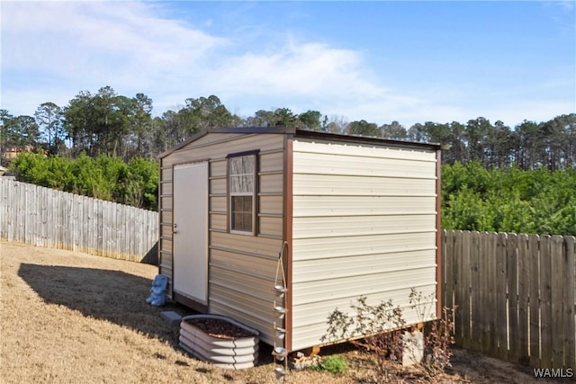 view of shed featuring a fenced backyard