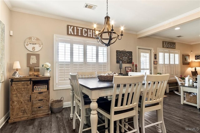 dining area featuring a notable chandelier, visible vents, ornamental molding, wood finished floors, and baseboards