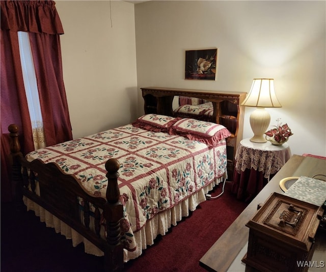 bedroom featuring dark colored carpet