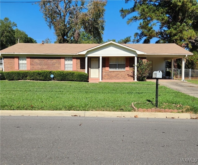 ranch-style house with a front lawn and a carport