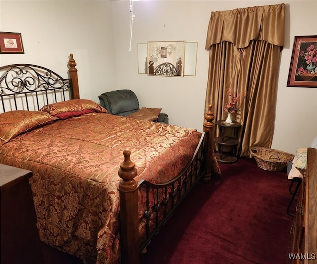 bedroom featuring dark carpet