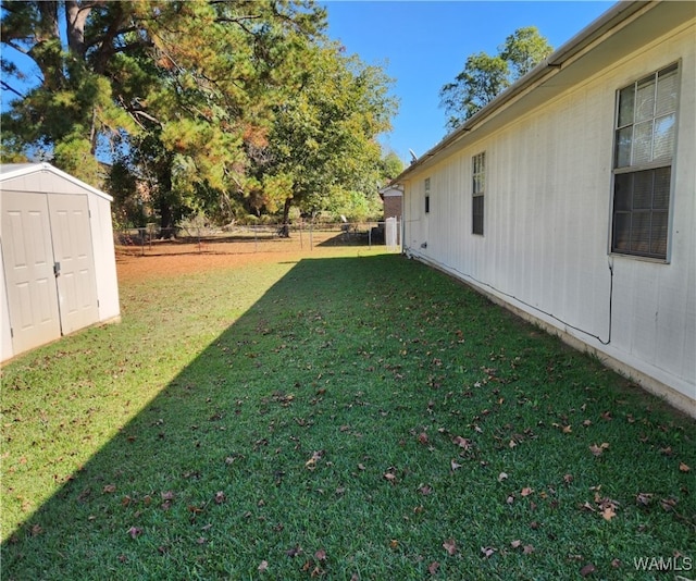 view of yard with a storage unit