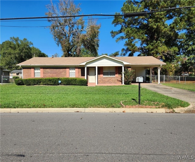 ranch-style home with a front yard and a carport