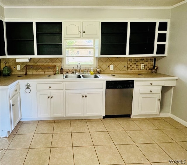 kitchen with dishwasher, backsplash, sink, light tile patterned floors, and white cabinetry