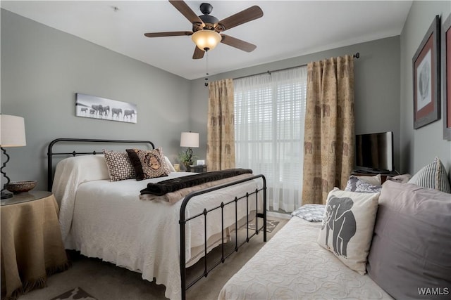 carpeted bedroom featuring a ceiling fan