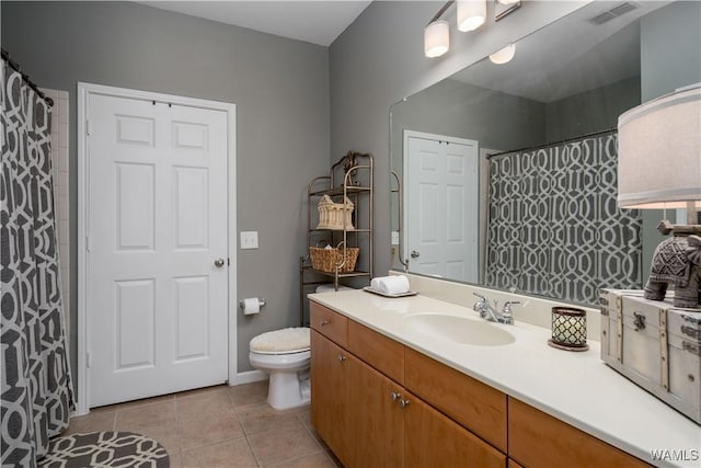 full bath featuring vanity, toilet, tile patterned floors, curtained shower, and visible vents