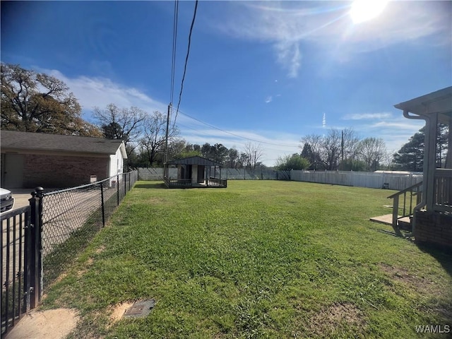 view of yard featuring a fenced backyard and a gazebo