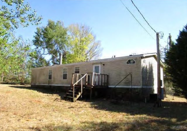 120 Meadow Ridge Dr, Al, Wetumpka, AL 36093 - back of house with a wooden deck and a yard
