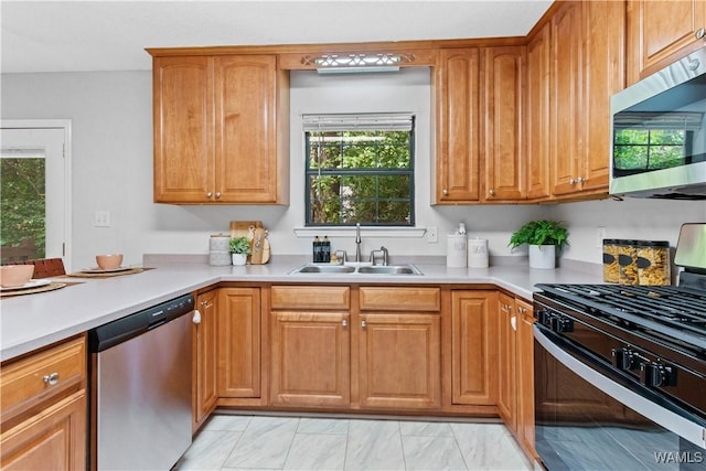 kitchen with sink and appliances with stainless steel finishes