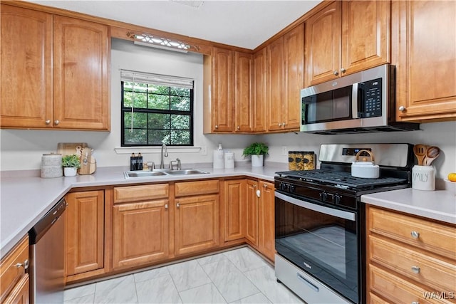 kitchen featuring appliances with stainless steel finishes and sink