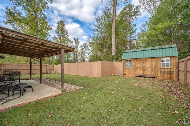 view of yard featuring a storage shed, a patio, an outdoor structure, and a fenced backyard