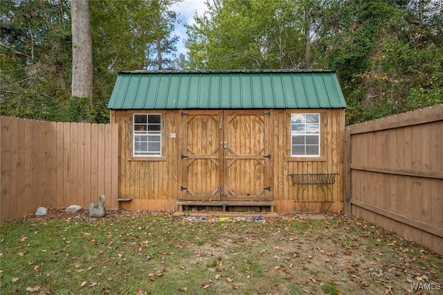 view of shed featuring a fenced backyard