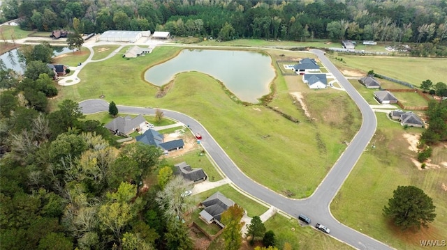 aerial view with a water view and a forest view