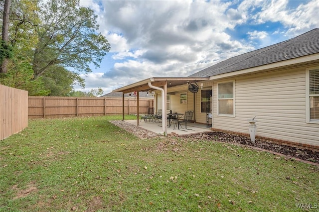 view of yard with a patio area and a fenced backyard