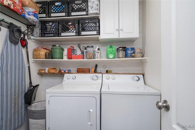 laundry area with cabinet space and washer and clothes dryer