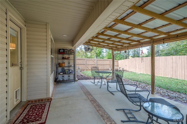 view of patio featuring outdoor dining space and a fenced backyard