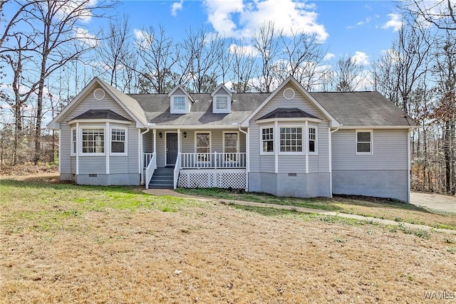 view of front of home with crawl space, covered porch, and a front yard