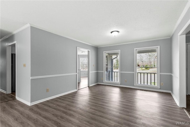 empty room with a wealth of natural light, dark wood-style flooring, and baseboards