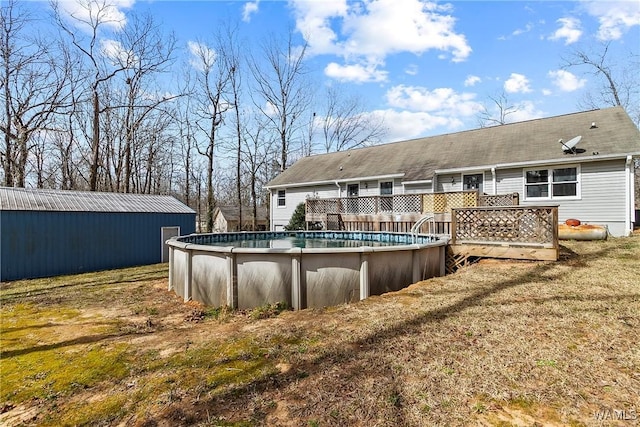 pool featuring a lawn and a deck