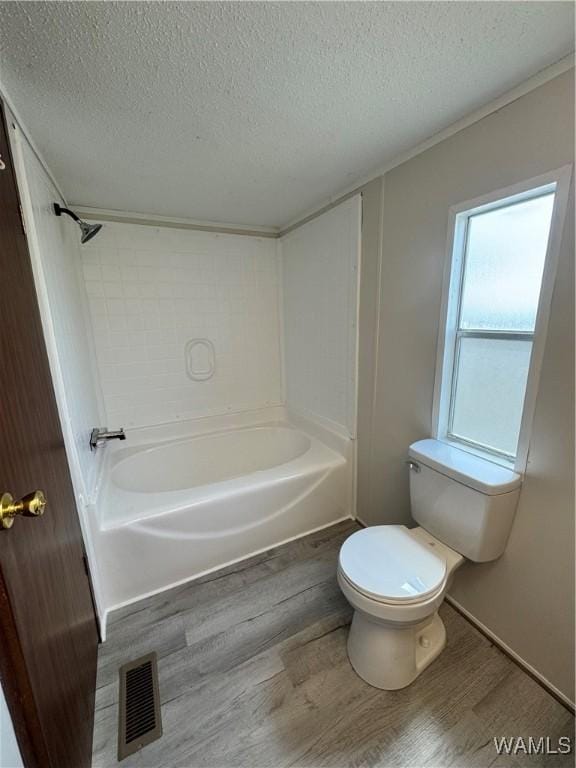 4247 W Ashby Rd, Brierfield, AL 35035 - full bathroom with wood finished floors, a textured ceiling,  shower combination, and ornamental molding