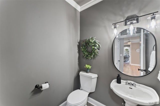 20892 Sharon Dr, Lake View, AL 35111 - bathroom with toilet, ornamental molding, baseboards, a sink, and ceiling fan
