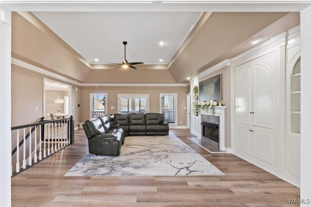 20892 Sharon Dr, Lake View, AL 35111 - living area with a ceiling fan, ornamental molding, a fireplace with flush hearth, and wood finished floors