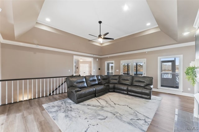 20892 Sharon Dr, Lake View, AL 35111 - living area featuring wood finished floors, ornamental molding, a tray ceiling, and ceiling fan