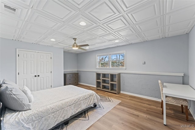 20892 Sharon Dr, Lake View, AL 35111 - bedroom featuring an ornate ceiling, a closet, wood finished floors, and baseboards