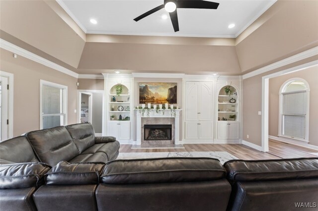 20892 Sharon Dr, Lake View, AL 35111 - living room with a fireplace, light wood-style flooring, ceiling fan, and built in shelves