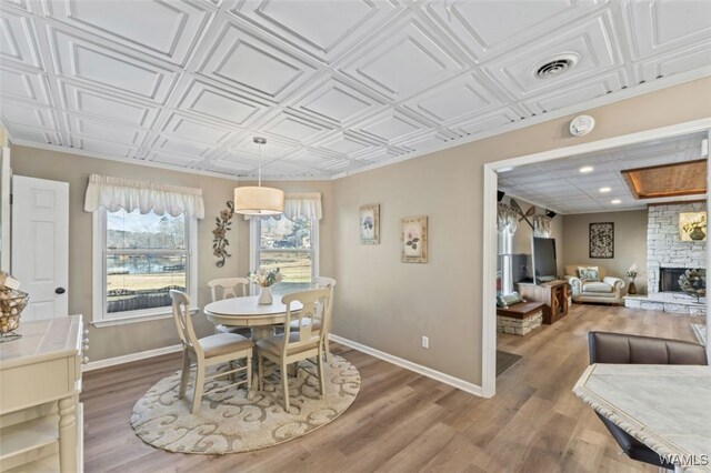 20892 Sharon Dr, Lake View, AL 35111 - dining room featuring baseboards, visible vents, and wood finished floors