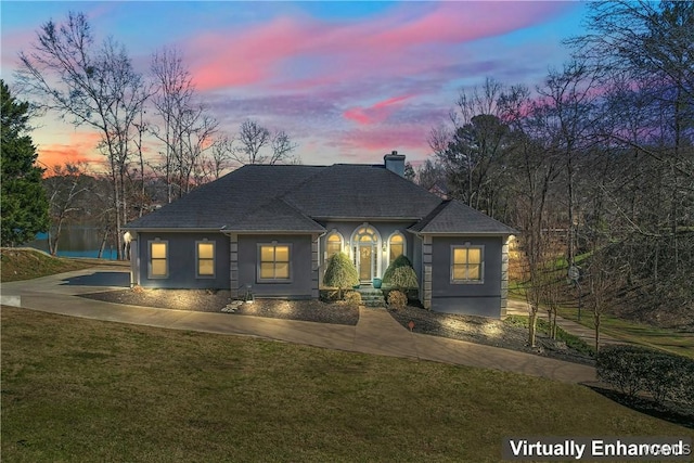 20892 Sharon Dr, Lake View, AL 35111 - view of front of property with a front lawn, a chimney, a shingled roof, and concrete driveway