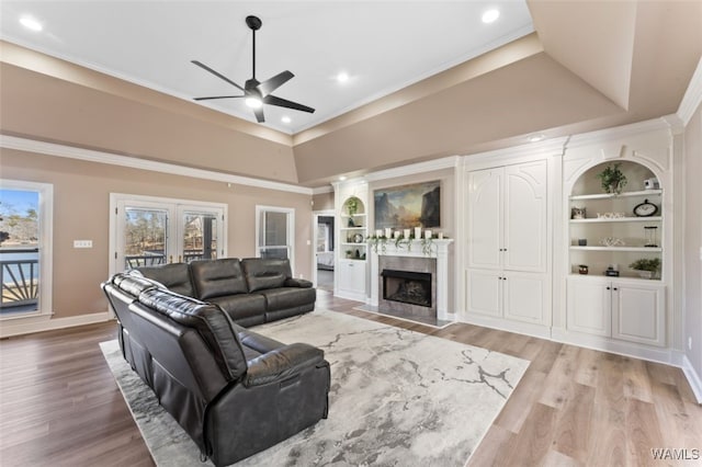 20892 Sharon Dr, Lake View, AL 35111 - living area featuring a high end fireplace, a raised ceiling, wood finished floors, and ceiling fan