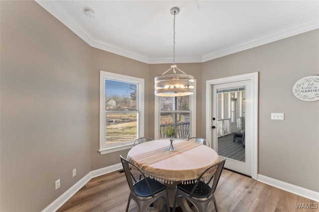 20892 Sharon Dr, Lake View, AL 35111 - dining space featuring crown molding, baseboards, and light wood-type flooring