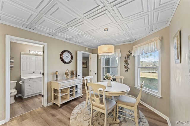 20892 Sharon Dr, Lake View, AL 35111 - dining area with an ornate ceiling, light wood-style flooring, and baseboards