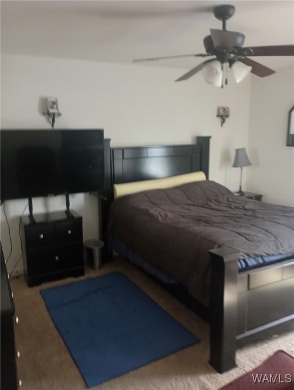 carpeted bedroom featuring a ceiling fan