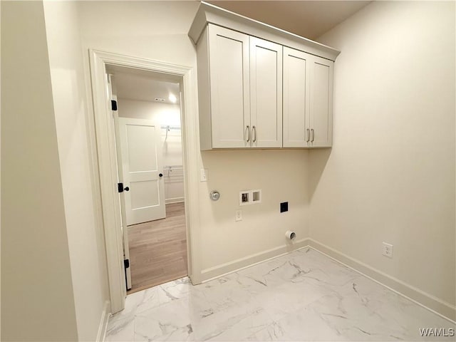 laundry room with cabinet space, marble finish floor, baseboards, and hookup for a washing machine