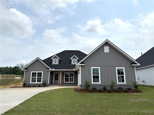 view of front of home with a front lawn and board and batten siding